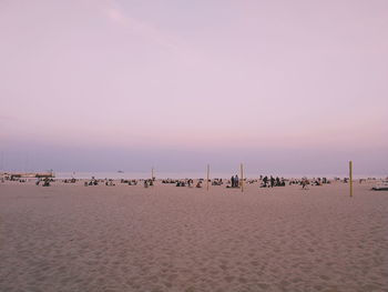 Scenic view of beach against sky during sunset