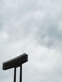 Low angle view of floodlight against sky