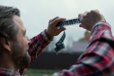 Close-up of man playing guitar