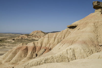 Scenic view of desert against clear sky