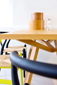 Empty chairs by table in room