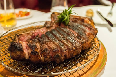 Close-up of meat on barbecue grill