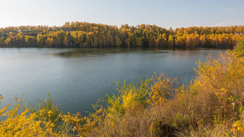 Scenic view of lake against sky during autumn