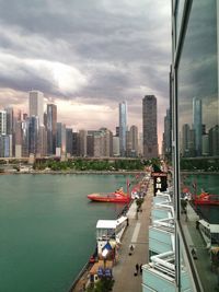 Buildings in city against sky