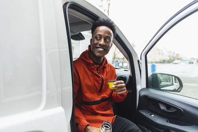 Portrait of young man using mobile phone