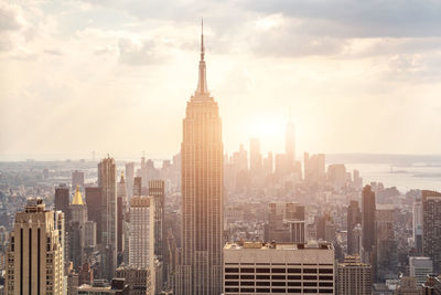 Cityscape against sky during sunset