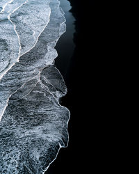 High angle view of black sand beach