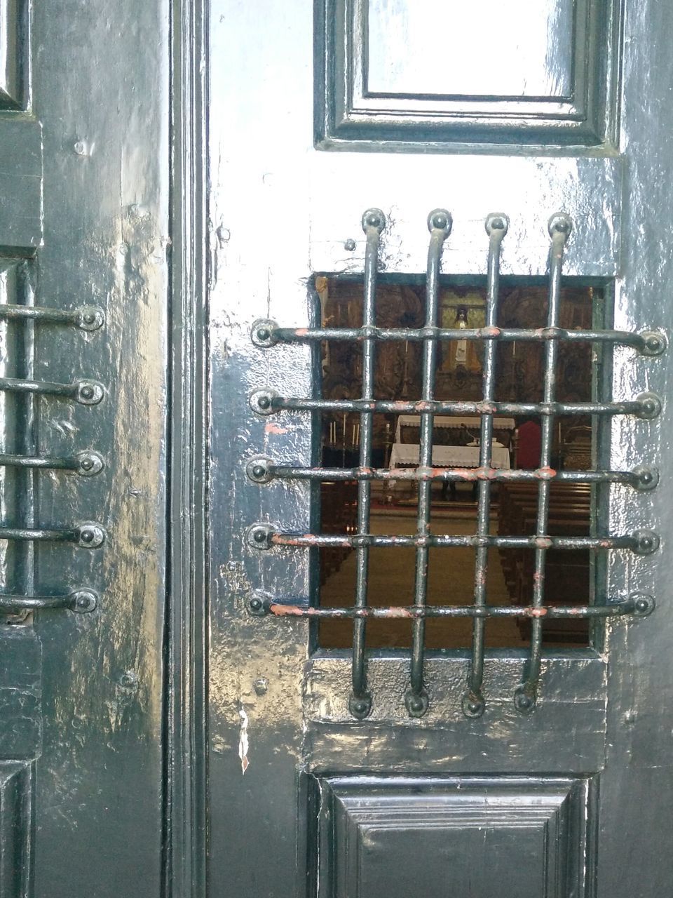 CLOSE-UP OF WINDOW WITH REFLECTION OF BUILDING