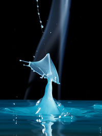 Close-up of water splashing on black background