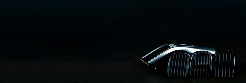 Close-up of illuminated lamp against black background