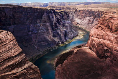 High angle view of stream amidst rock formations