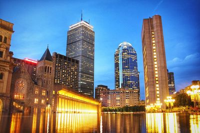 Reflection of illuminated buildings in water