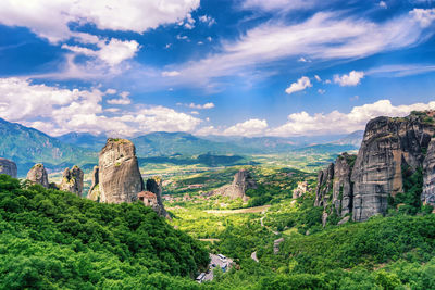 Scenic view of landscape against cloudy sky