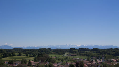 Scenic view of mountains against clear blue sky