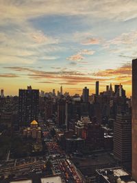 Cityscape against sky during sunset