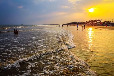 Scenic view of beach against sky during sunset