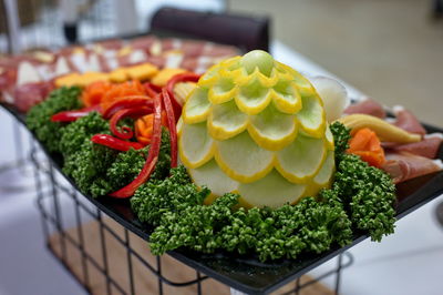 Nice decorated catering with vegetables, processed meat and cheese