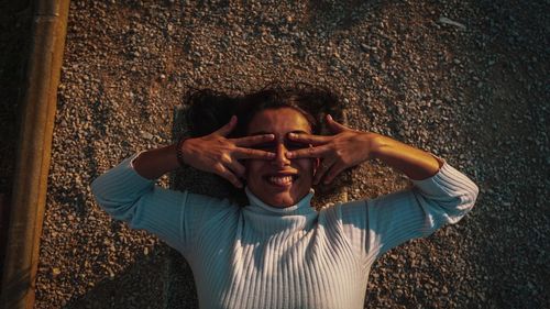 Portrait of young woman wearing sunglasses standing outdoors