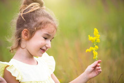 Portrait of cute girl with flowers