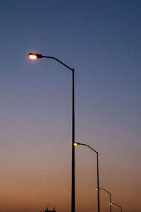 Low angle view of street light against clear sky