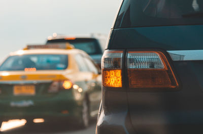 Close-up of car on road