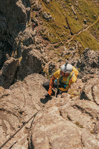 Full length of man on rock in mountains