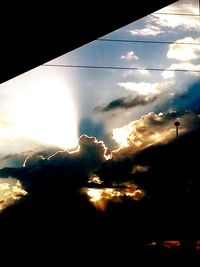 Low angle view of cloudy sky at sunset