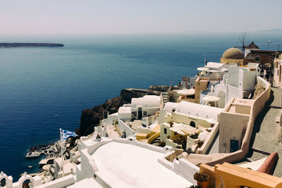High angle view of buildings against sea