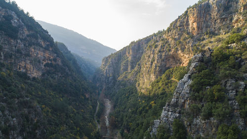 Scenic view of mountains against sky. aerial shot of the green valley 