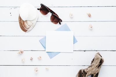 High angle view of seashell on wooden table