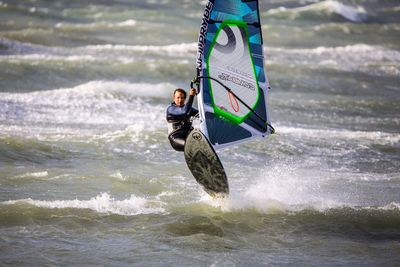 Woman jumping in water