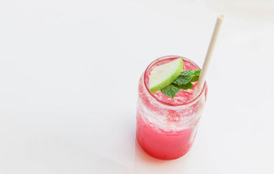 Close-up of strawberry over white background