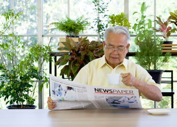 Portrait of a man sitting on table