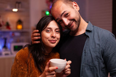 Young woman drinking coffee at home