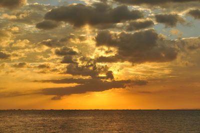 Scenic view of sea against orange sky