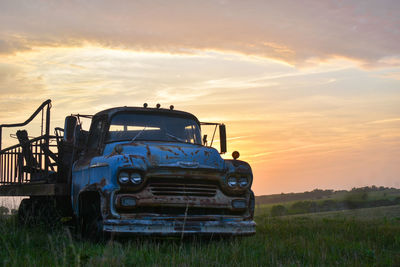 Scenic view of field against sky during sunset