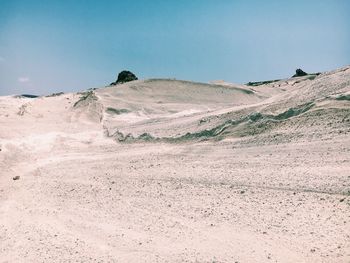 Scenic view of desert against clear sky