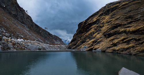 Scenic view of lake and mountains against sky