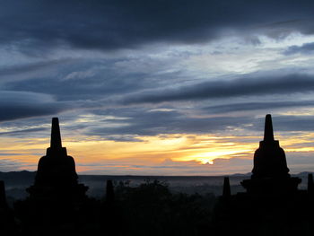 Statue of church at sunset