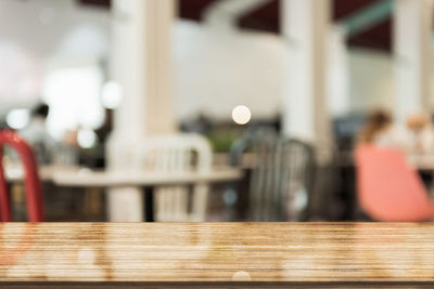 Close-up of empty chairs and table in restaurant