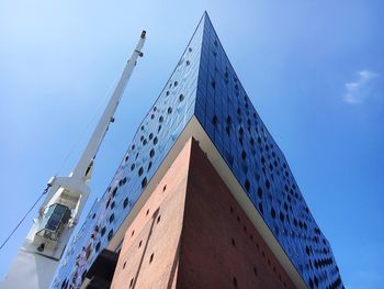 Low angle view of building against blue sky