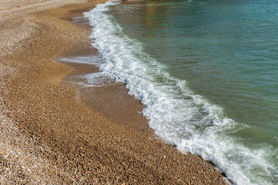 High angle view of surf on beach