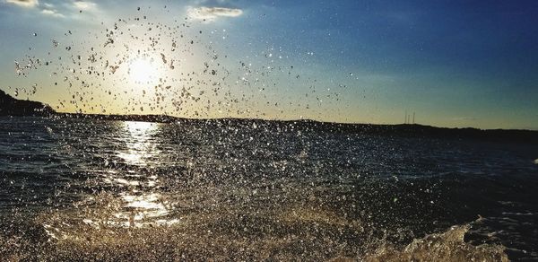 Scenic view of sea against sky at sunset