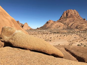 Scenic view of rocky mountains against clear sky