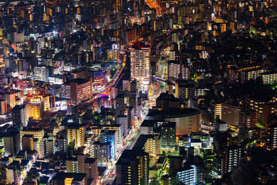 High angle view of illuminated modern buildings at night