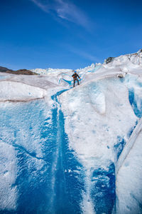 Scenic view of frozen lake against sky