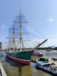 Boats moored at harbor