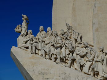 Low angle view of statue against sky