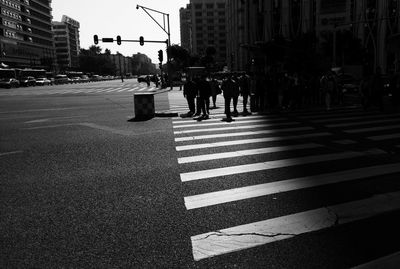 People walking on road in city