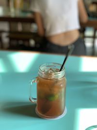 Close-up of drink in glass jar on table